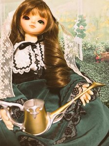 Rating: Safe Score: 0 Tags: 1girl bangs black_dress brown_hair doll dress green_eyes holding lace long_hair long_sleeves looking_at_viewer sitting solo suiseiseki User: admin