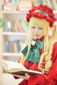 Rating: Safe Score: 0 Tags: 1girl blonde_hair blue_eyes blurry blurry_background blurry_foreground book bookshelf depth_of_field dress flower library long_hair open_book photo red_dress shinku sitting solo User: admin