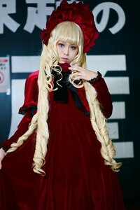 Rating: Safe Score: 0 Tags: 1girl bangs blonde_hair blue_eyes blurry bonnet depth_of_field dress flower long_hair long_sleeves looking_at_viewer red_dress rose shinku solo very_long_hair User: admin