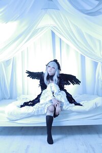 Rating: Safe Score: 0 Tags: 1girl black_legwear blurry closed_mouth curtains dress feathered_wings feathers indoors long_hair long_sleeves sitting solo suigintou white_hair window wings User: admin