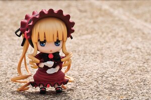 Rating: Safe Score: 0 Tags: 1girl blonde_hair blue_eyes bonnet bow chibi doll dress long_hair looking_at_viewer red_dress shinku shoes sitting solo twintails User: admin