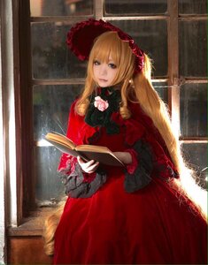 Rating: Safe Score: 0 Tags: 1girl blonde_hair blue_eyes bonnet book dress flower holding holding_book long_hair long_sleeves looking_at_viewer open_book red_dress rose shinku solo window User: admin