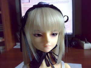 Rating: Safe Score: 0 Tags: 1girl 3d bangs black_ribbon blonde_hair blurry blurry_background closed_mouth depth_of_field detached_collar doll hairband indoors lips looking_at_viewer photo purple_eyes ribbon solo suigintou User: admin