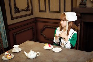 Rating: Safe Score: 0 Tags: 1girl brown_hair cake chair cup dress food hat indoors long_hair plate sitting solo suiseiseki table teacup User: admin