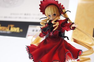 Rating: Safe Score: 0 Tags: 1girl blonde_hair blue_eyes blurry bonnet bow depth_of_field doll dress drill_hair frills long_hair long_sleeves looking_at_viewer photo red_dress shinku solo standing twintails User: admin