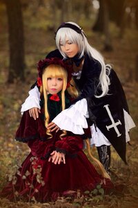 Rating: Safe Score: 0 Tags: 2girls blonde_hair blurry closed_eyes depth_of_field dress frills long_hair long_sleeves multiple_cosplay multiple_girls red_dress shinku silver_hair suigintou tagme User: admin