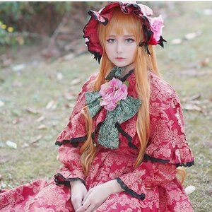 Rating: Safe Score: 0 Tags: 1girl blonde_hair blue_eyes blurry blurry_background bonnet depth_of_field dress flower frills long_hair looking_at_viewer photo red_dress shinku sitting solo User: admin