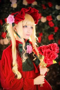 Rating: Safe Score: 0 Tags: 1girl bangs blonde_hair blue_eyes blurry blurry_background blurry_foreground bouquet depth_of_field dress flower holding holding_flower lips long_hair photo pink_flower pink_rose red_dress red_flower red_rose rose shinku sidelocks solo upper_body User: admin
