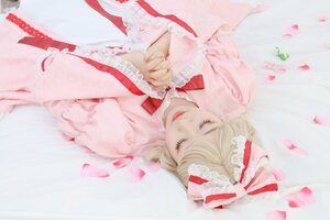 Rating: Safe Score: 0 Tags: 1girl blonde_hair blurry cherry_blossoms closed_eyes depth_of_field dress frills hair_ribbon lips long_hair long_sleeves own_hands_together petals realistic ribbon smile solo striped User: admin