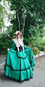 Rating: Safe Score: 0 Tags: 1girl brown_hair day dress green_dress long_hair looking_at_viewer outdoors skirt_hold smile solo standing suiseiseki sunlight tree User: admin