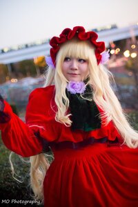 Rating: Safe Score: 0 Tags: 1girl blonde_hair blue_eyes blurry blurry_background bonnet depth_of_field dress flower long_hair long_sleeves photo red_dress rose shinku solo User: admin