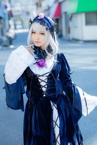 Rating: Safe Score: 0 Tags: 1girl 3d black_dress blurry blurry_background blurry_foreground closed_mouth depth_of_field dress flower frills gothic_lolita hairband long_sleeves looking_at_viewer photo solo standing suigintou User: admin