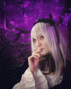 Rating: Safe Score: 0 Tags: 1girl bangs blurry closed_mouth dress finger_to_mouth flower hairband lips long_hair long_sleeves looking_at_viewer realistic red_eyes solo suigintou upper_body User: admin