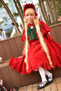 Rating: Safe Score: 0 Tags: 1girl blonde_hair blue_eyes blurry bonnet bow capelet depth_of_field dress flower long_hair looking_at_viewer pantyhose red_dress rose shinku shoes sitting solo white_legwear wooden_floor User: admin