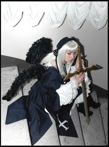 Rating: Safe Score: 0 Tags: 1girl bangs black_border blue_eyes border dress feathers frills letterboxed long_sleeves pillarboxed sitting solo suigintou weapon white_hair wings User: admin