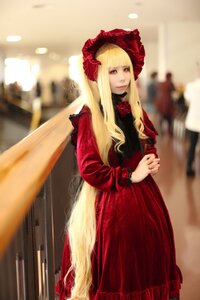 Rating: Safe Score: 0 Tags: 1girl bangs blonde_hair blurry blurry_background blurry_foreground bonnet depth_of_field dress flower frills lips long_hair long_sleeves looking_at_viewer photo red_dress shinku solo standing User: admin