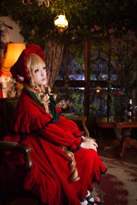 Rating: Safe Score: 0 Tags: 1girl blonde_hair blue_eyes bonnet dress flower long_hair red_dress shinku sitting solo User: admin