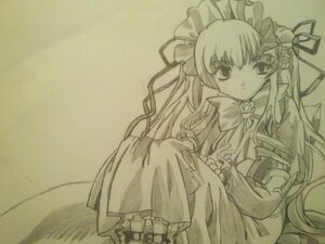 Rating: Safe Score: 0 Tags: 1girl bow bowtie dress frills image long_hair long_sleeves looking_at_viewer monochrome ribbon rose shinku sitting solo very_long_hair User: admin