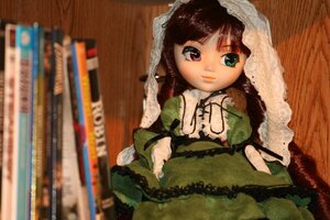 Rating: Safe Score: 0 Tags: 1girl bangs blurry brown_hair depth_of_field doll dress frills green_dress heterochromia juliet_sleeves long_hair long_sleeves looking_at_viewer photo red_eyes sitting solo suiseiseki User: admin