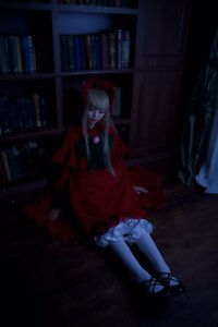 Rating: Safe Score: 0 Tags: 1girl book bookshelf dark dress frills indoors long_hair red_dress shinku sitting solo User: admin