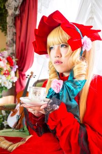 Rating: Safe Score: 0 Tags: 1girl blonde_hair blue_eyes blurry blurry_background blurry_foreground bow cup curtains depth_of_field dress drill_hair flower food lips long_hair realistic red_dress rose shinku sitting solo teacup User: admin