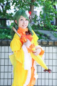 Rating: Safe Score: 0 Tags: 1girl blurry blurry_background closed_umbrella depth_of_field dress flower green_hair hair_flower hair_ornament kanaria photo smile solo standing umbrella yellow_dress User: admin