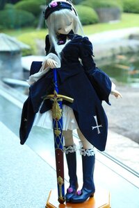 Rating: Safe Score: 0 Tags: 1girl blurry blurry_background boots depth_of_field doll dress frills hat kneehighs long_hair long_sleeves solo standing suigintou sword weapon white_hair User: admin