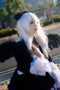 Rating: Safe Score: 0 Tags: 1girl black_dress blurry blurry_background bow depth_of_field dress hair_bow lips long_hair long_sleeves outdoors solo suigintou white_hair User: admin