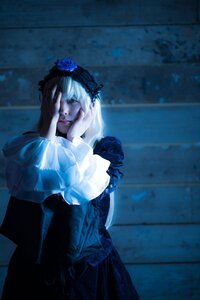 Rating: Safe Score: 0 Tags: 1girl blue_theme closed_eyes dress flower frills hairband hands_on_own_face long_hair long_sleeves sitting solo suigintou User: admin