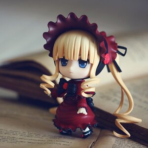 Rating: Safe Score: 0 Tags: 1girl blonde_hair blue_eyes blurry bonnet bow chibi cup doll dress drill_hair figure frills indoors long_hair long_sleeves looking_at_viewer photo red_dress rose shinku sitting solo teacup twintails User: admin