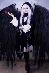 Rating: Safe Score: 0 Tags: 1girl black_wings dress feathered_wings feathers flower frills full_body hairband holding long_hair long_sleeves ribbon silver_hair solo standing suigintou wings User: admin