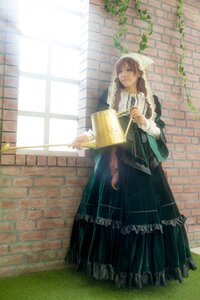 Rating: Safe Score: 0 Tags: 1girl apron black_dress brick_wall brown_hair dress frills long_sleeves maid solo standing suiseiseki window User: admin