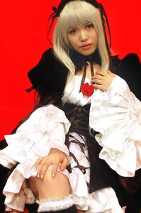 Rating: Safe Score: 0 Tags: 1girl blonde_hair choker dress fingernails flower frills gothic_lolita hairband lace lips lolita_fashion long_hair long_sleeves looking_at_viewer nail_polish realistic red_background rose simple_background solo suigintou thighhighs User: admin