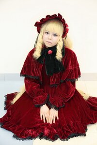 Rating: Safe Score: 0 Tags: 1girl bangs blonde_hair blue_eyes bonnet capelet dress drill_hair frills long_hair long_sleeves looking_at_viewer red_dress shinku sitting solo v_arms User: admin