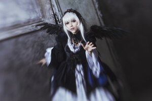 Rating: Safe Score: 0 Tags: 1girl black_dress black_wings blurry blurry_background depth_of_field dress lips long_hair long_sleeves looking_at_viewer ribbon rose silver_hair solo standing suigintou wide_sleeves wings User: admin