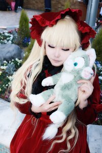Rating: Safe Score: 0 Tags: 1girl bangs blonde_hair blurry blurry_background bow building closed_eyes depth_of_field dress holding lace long_hair long_sleeves outdoors photo red_dress shinku solo User: admin