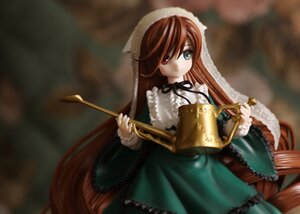 Rating: Safe Score: 0 Tags: 1girl blurry brown_hair doll dress frills green_dress heterochromia holding long_hair long_sleeves looking_at_viewer red_eyes ribbon solo suiseiseki very_long_hair watering_can User: admin