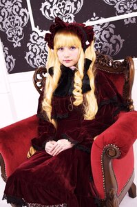 Rating: Safe Score: 0 Tags: 1girl bangs blonde_hair blue_eyes blunt_bangs bonnet chair dress drill_hair lips long_hair looking_at_viewer red_dress shinku sitting solo User: admin