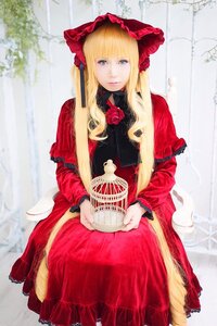 Rating: Safe Score: 0 Tags: 1girl bangs blonde_hair blue_eyes bonnet dress flower holding lips long_hair long_sleeves looking_at_viewer red_dress rose shinku sitting solo very_long_hair User: admin