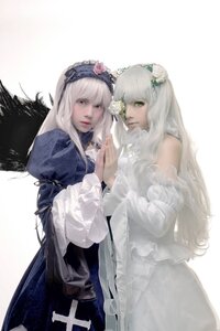 Rating: Safe Score: 0 Tags: 2girls bangs dress flower frills green_eyes hair_flower hair_ornament hairband lips long_hair long_sleeves looking_at_viewer multiple_cosplay multiple_girls silver_hair sisters suigintou tagme white_hair wings User: admin