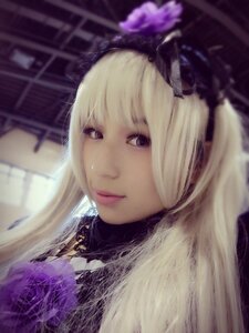 Rating: Safe Score: 0 Tags: 1girl bangs blonde_hair blurry blurry_background blurry_foreground closed_mouth depth_of_field flower lips long_hair looking_at_viewer purple_eyes solo suigintou User: admin