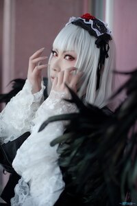 Rating: Safe Score: 0 Tags: 1girl bangs blurry blurry_background closed_mouth depth_of_field dress flower frills gothic_lolita hairband lace lolita_fashion long_hair long_sleeves red_eyes rose signature silver_hair solo suigintou User: admin
