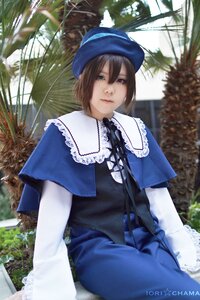 Rating: Safe Score: 0 Tags: 1girl blue_dress blue_headwear brown_hair capelet dress hat looking_at_viewer outdoors short_hair sitting solo souseiseki tree User: admin