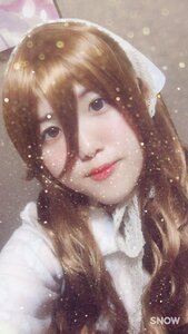 Rating: Safe Score: 0 Tags: 1girl artist_name brown_hair light_particles lips looking_at_viewer rain snowing solo suiseiseki watermark User: admin