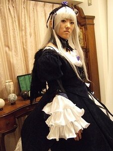 Rating: Safe Score: 0 Tags: 1girl bangs black_dress curtains dress flower frills hair_ornament indoors long_hair long_sleeves looking_at_viewer solo standing suigintou white_hair User: admin