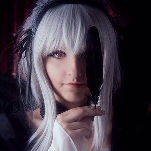 Rating: Safe Score: 0 Tags: 1girl bangs black_background closed_mouth hair_ornament portrait red_eyes solo suigintou white_hair User: admin