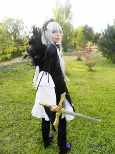 Rating: Safe Score: 0 Tags: 1girl flower grass hairband holding lips long_hair long_sleeves looking_at_viewer outdoors solo standing suigintou sword tree weapon User: admin