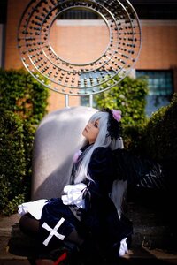 Rating: Safe Score: 0 Tags: 1girl black_dress blurry blurry_background depth_of_field dress frills gothic_lolita long_hair long_sleeves sitting solo suigintou User: admin