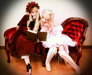 Rating: Safe Score: 0 Tags: 2girls blonde_hair book boots chair closed_eyes cross-laced_footwear dress flower knee_boots lolita_fashion long_hair multiple_cosplay multiple_girls red_dress sitting tagme User: admin