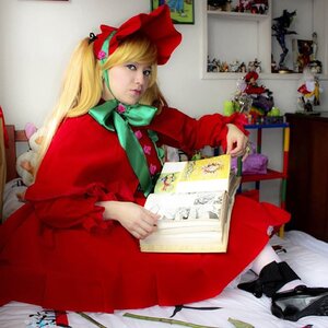 Rating: Safe Score: 0 Tags: 1girl blonde_hair blue_eyes book bow capelet doll dress lips long_hair realistic red_dress shinku sitting solo User: admin